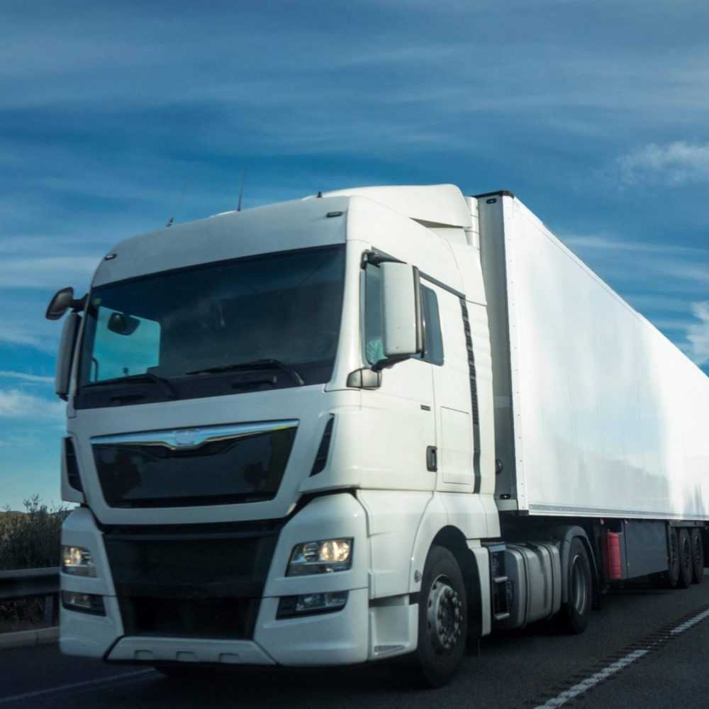 white-truck-on-highway-with-clouds-2026-03-17-00-31-09-utc (1)